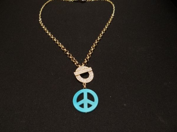 Colar dourado com Simbolo da Paz turquesa